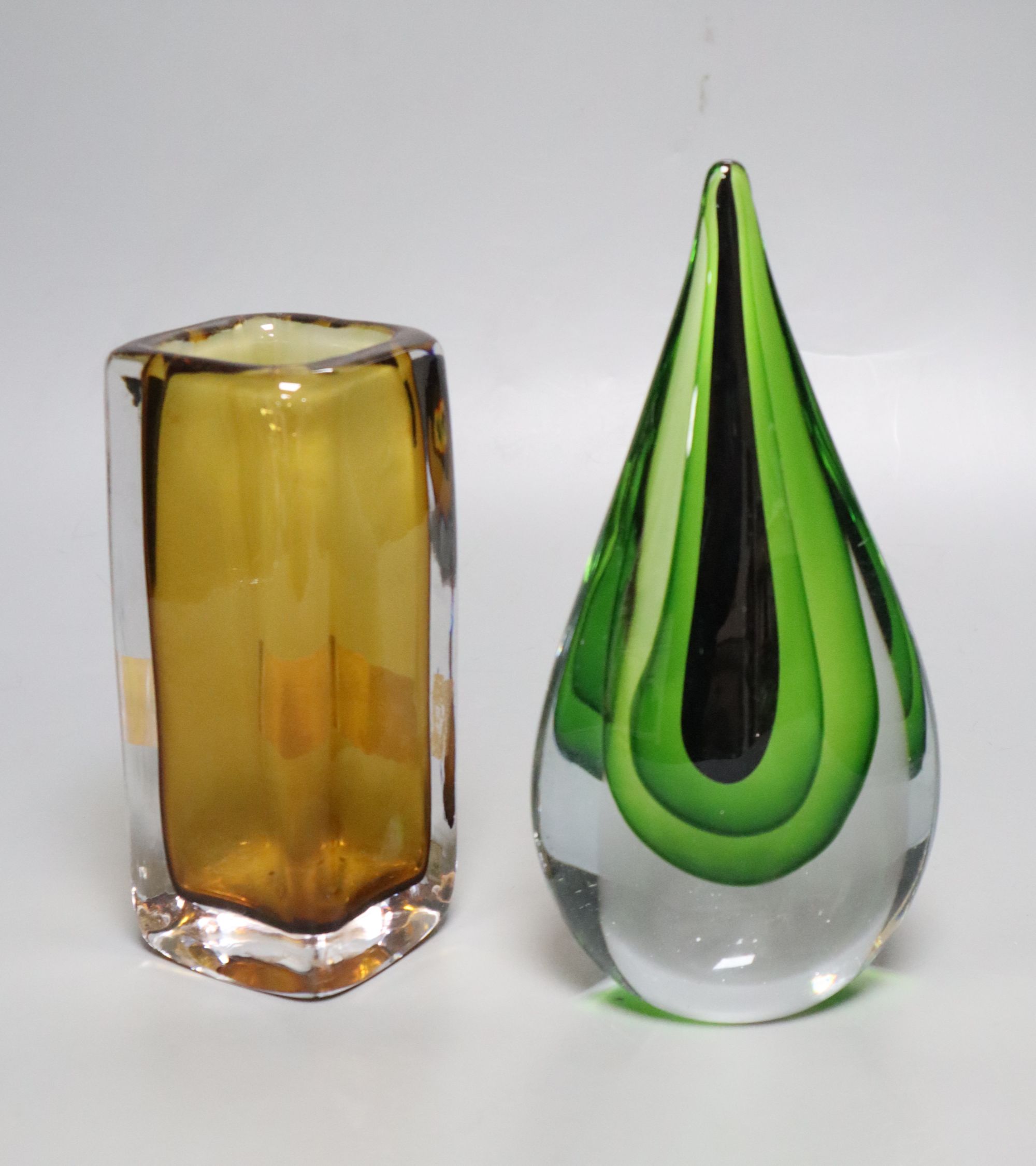 A Kosta amber glass vase and a green and clear glass ornament